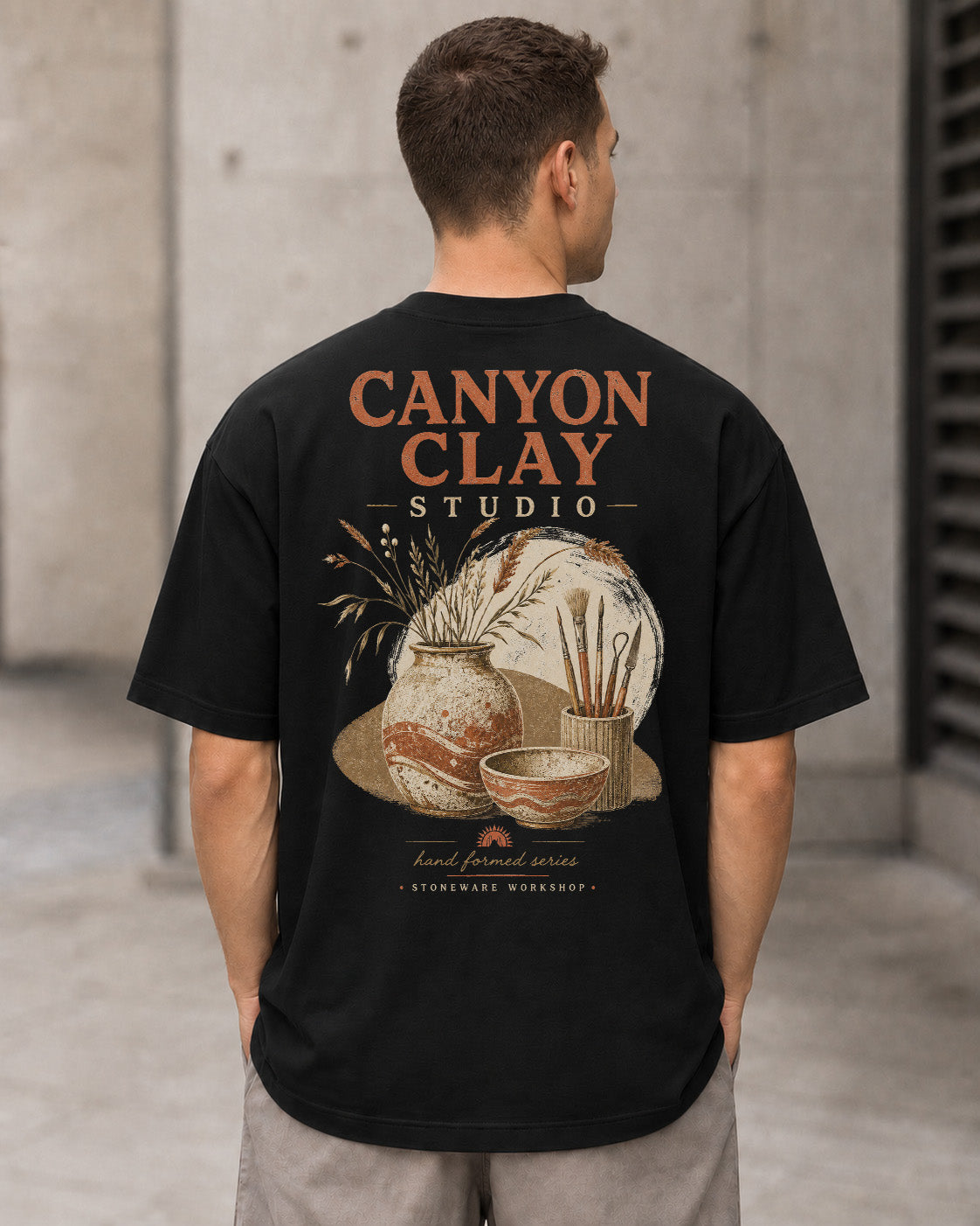 Canyon Clay Studio T-Shirt – Heavyweight Oversize Shirt Schwarz, Rückenprint